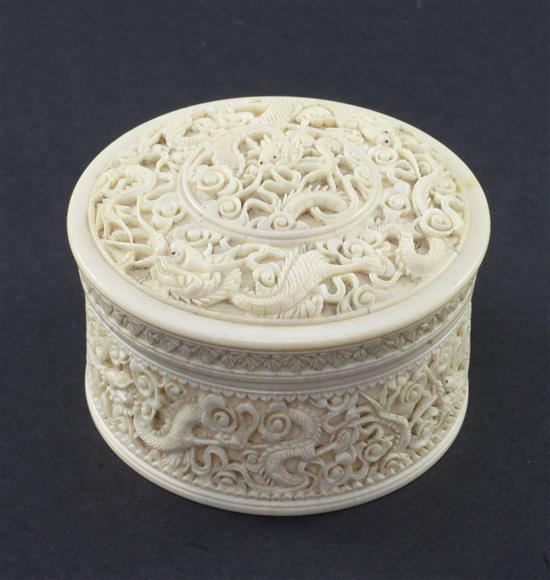 A Chinese ivory dragon drum shaped box and cover, early 20th century, diam. 10.5cm